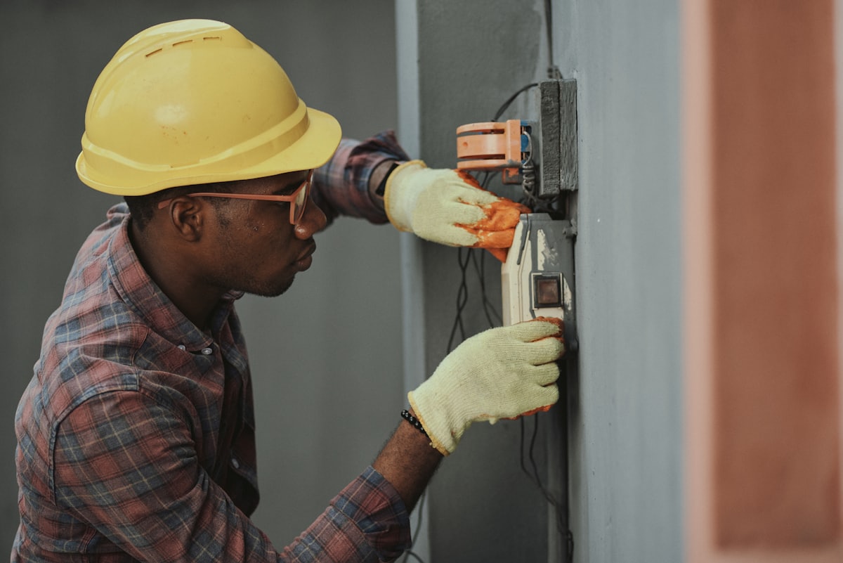 Licensed electrician wiring an electrical panel